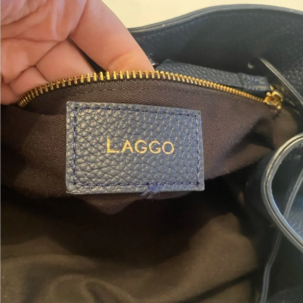 LAGGO || Andrea Tassel Drawstring Hobo Bag Pockets Pebbled Leather Navy‎